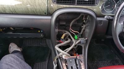 Existing headunit and ac controls, ashtray, gear surround, glove box removed